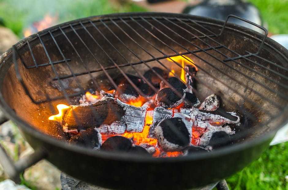 charcoal grill with fire and burning charcoals